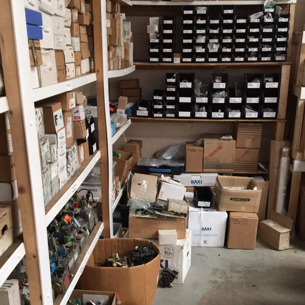 Boiler spare parts organised in storage bins at the BBS Ltd warehouse in Moston